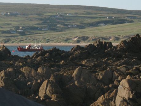 One of a number of ribs watching the camp from close off shore