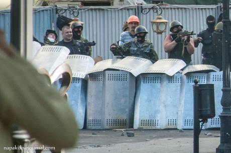 Click on image to see full-sized version Anti-Maidan thugs shooting pro-EuroMaidan march behind police lines in Odesa